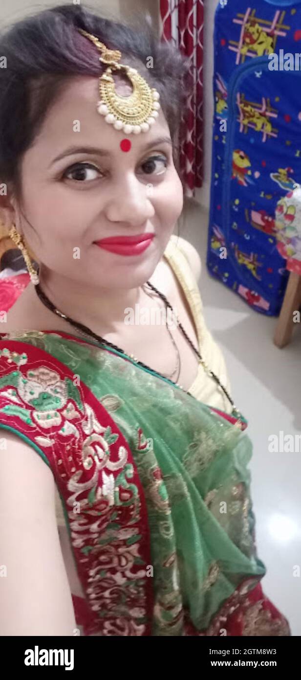 A Portrait Shot Of Indian Married Woman In Traditional Dress During Hindu Indian Religious Karwa