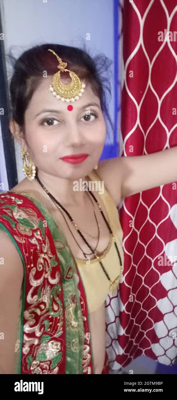 A Portrait Shot of Indian Married Woman in traditional dress during