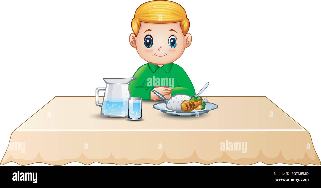 Мальчик ест за столом