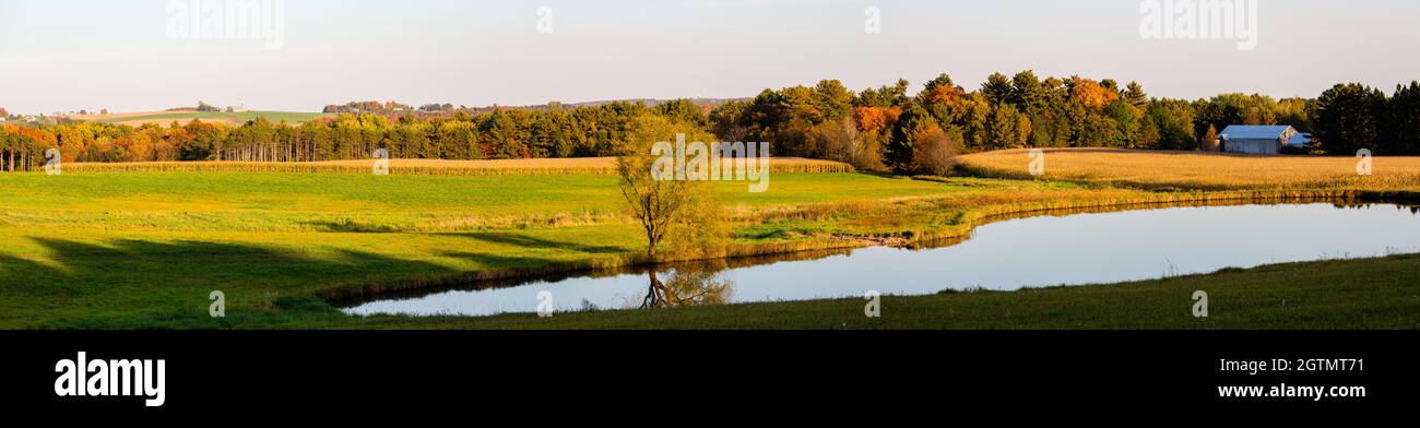 Wisconsin farmland with pond in late September, panorama Stock Photo
