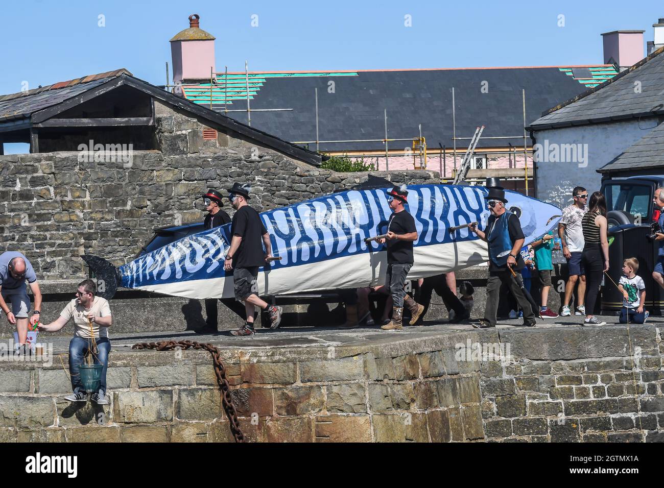 Aberaeron Mackerel Fiesta. There can’t be many fiestas where a funeral is the focus of the celebrations. And probably none where that funeral is for a Stock Photo