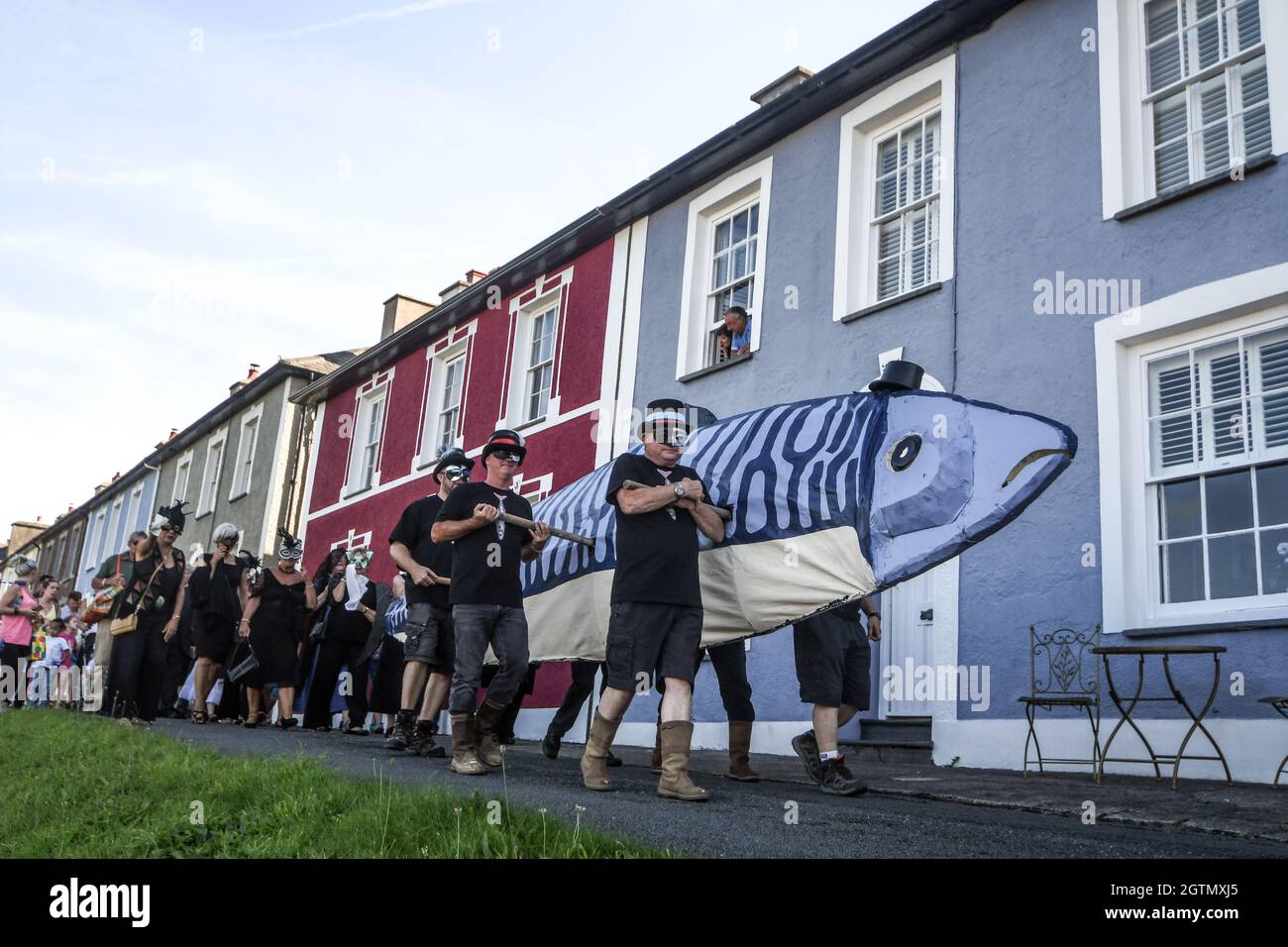 Saturday 26/08/2017 the harbor Aberaeron  WEST WALES UK  bands and a parade led by a 20-foot fish, the fiesta sees the fishing town honour the mackere Stock Photo