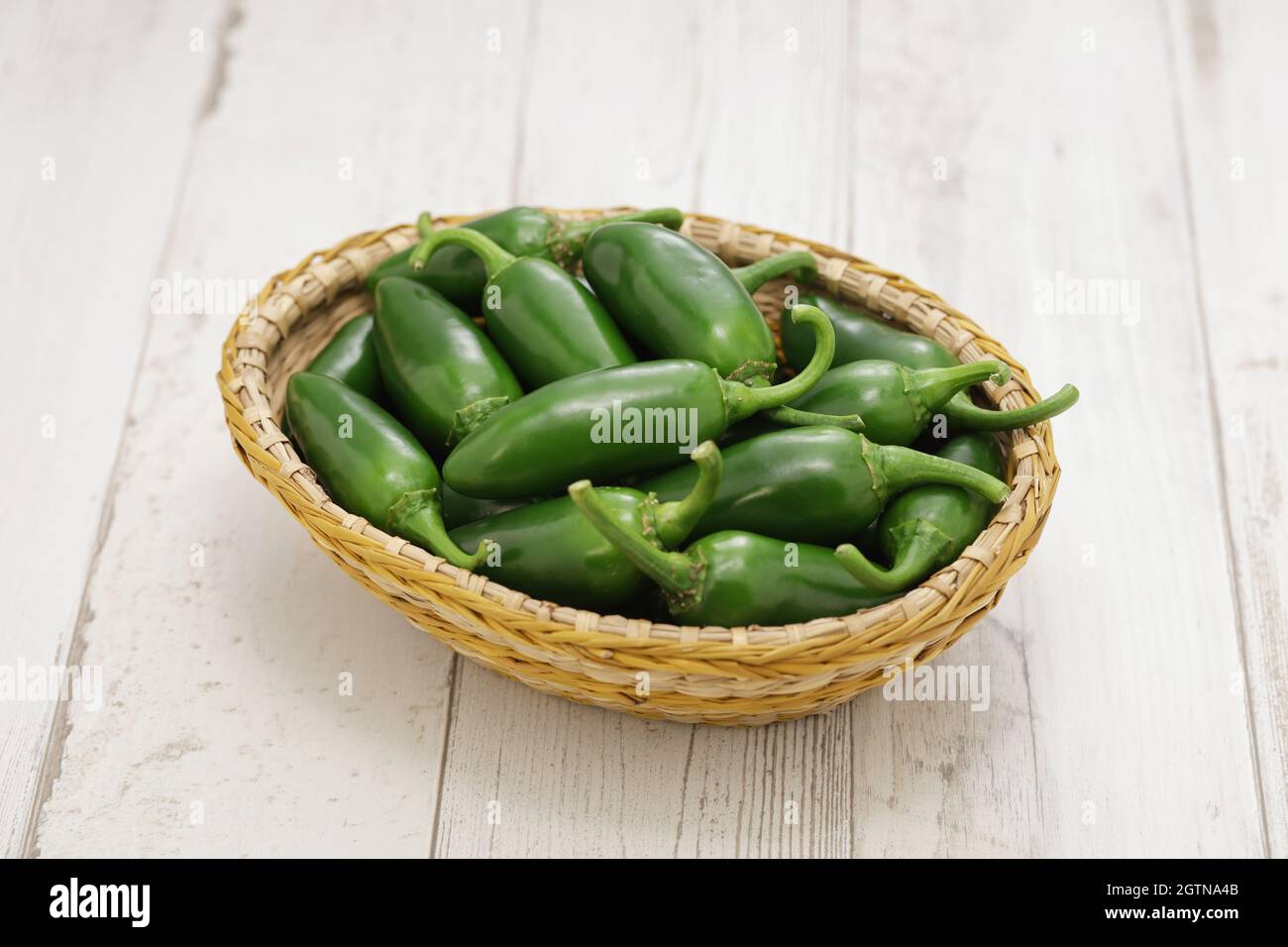 fresh jalapeno peppers in basket Stock Photo Alamy