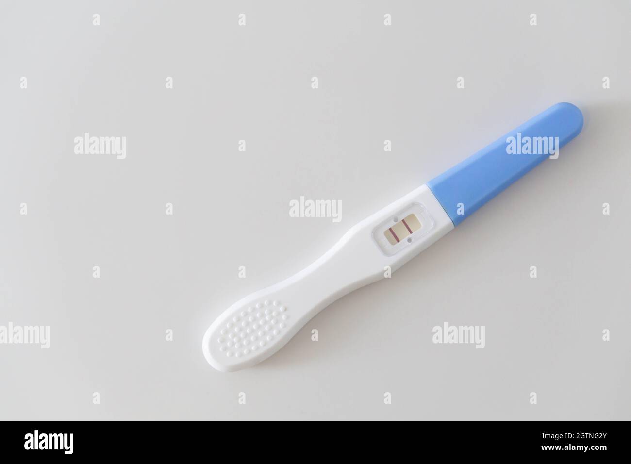 Pregnancy Test Against White Background Stock Photo