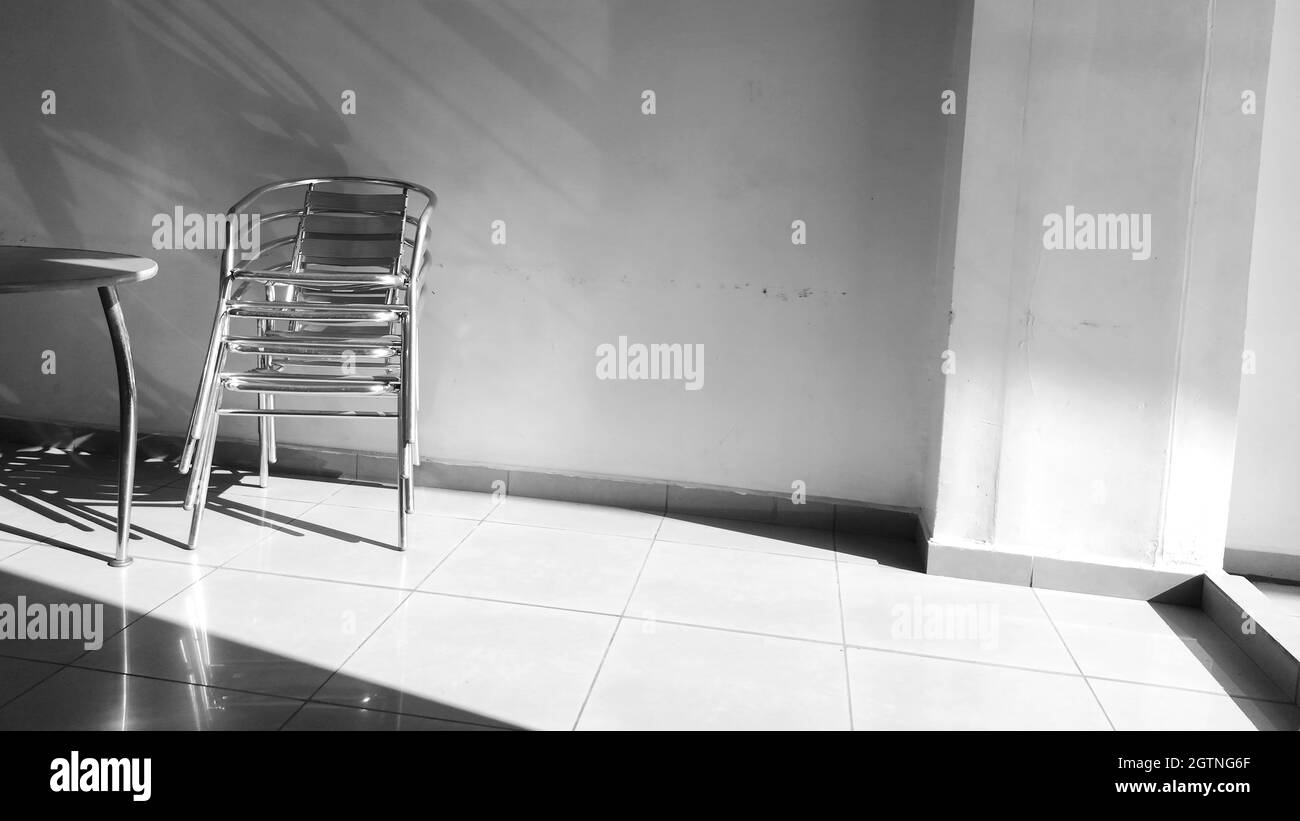 Empty Chair Against Wall At Home Stock Photo Alamy