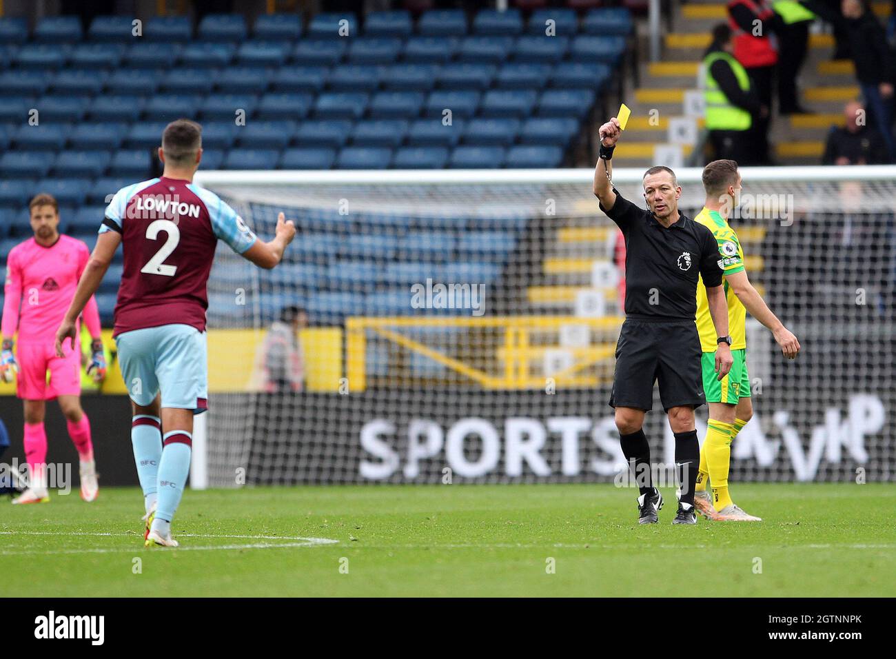 Burnley, UK. 02nd Oct, 2021. Match Referee Kevin Friend shows Matthew Lowton of Burnley a yellow cardduring the Premier League match between Burnley and Norwich City at Turf Moor on October 2nd 2021 in Burnley, England. (Photo by Mick Kearns/phcimages.com) Credit: PHC Images/Alamy Live News Stock Photo