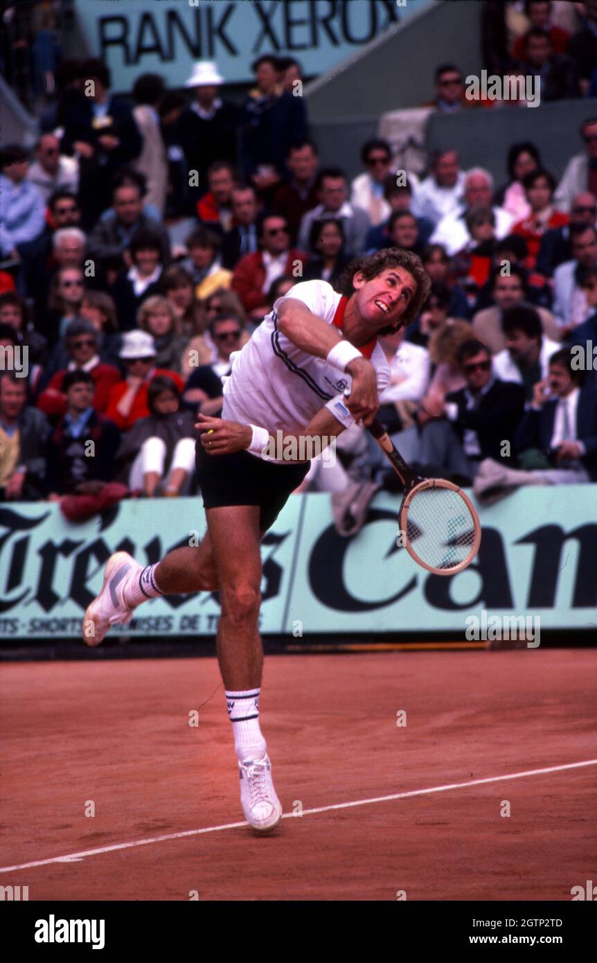 Brian Gottfried serving during a match at the French Open at Roland Garros in 1983. Stock Photo