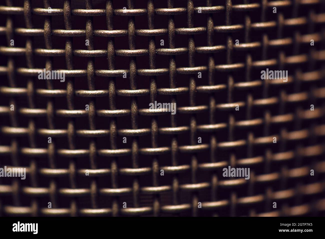 Metallic mesh background at black background Stock Photo - Alamy