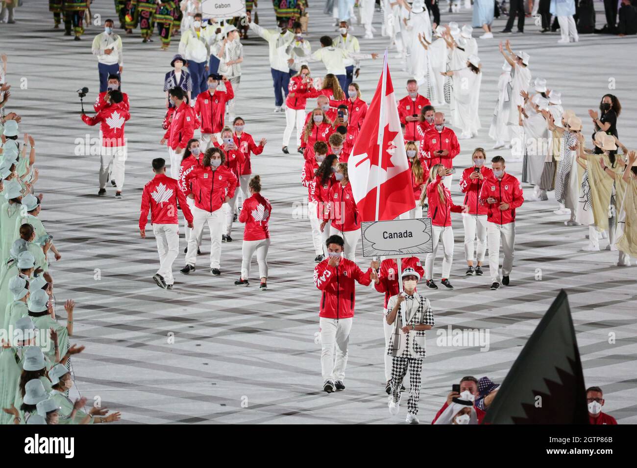 JULY 23rd, 2021 - TOKYO, JAPAN: Canada's flag bearers Miranda Ayim and Nathan Hirayama enter the Olympic Stadium with their delegation during the Para Stock Photo