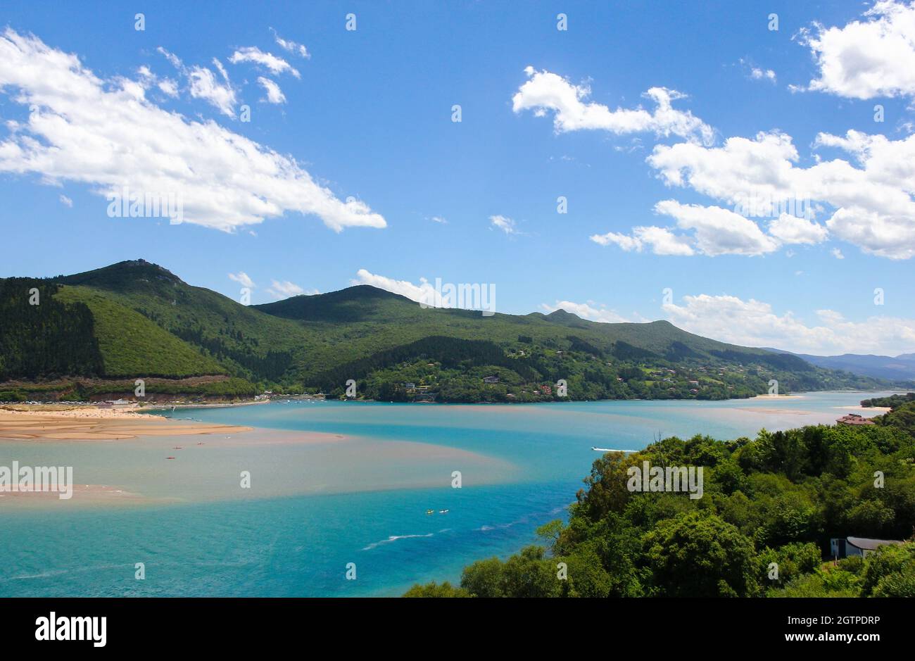 Splendid views of Urdaibai biosphere reserve with mountains, blue sky and white clouds in the Basque Country. Fabulous natural landscape Stock Photo