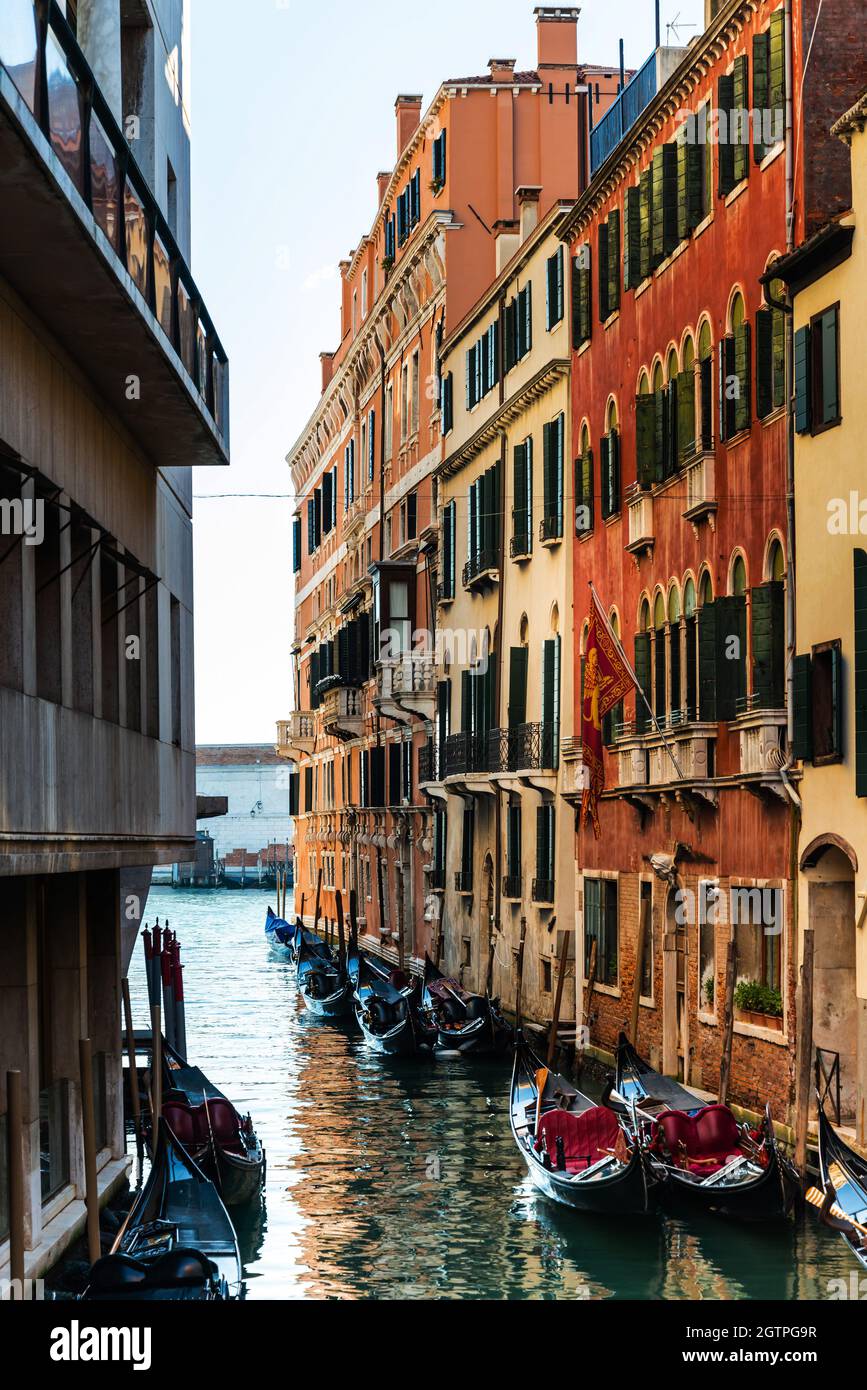 High Angle View Of Gondolas Moored In Canal Amidst Buildings In City Stock Photo