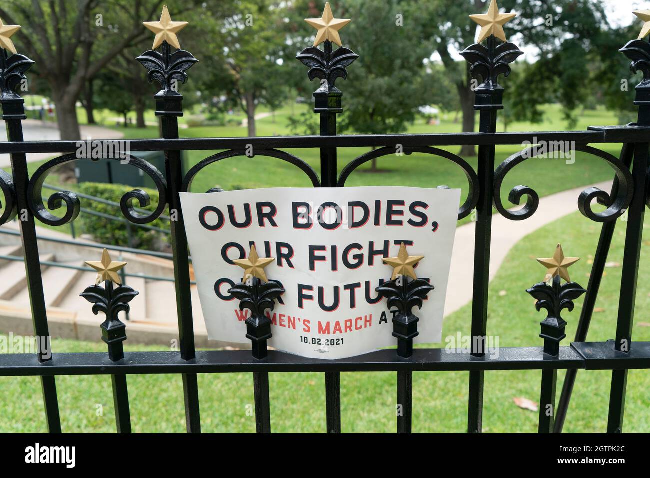 A sign on the Texas Capitol fence promotes the Women's March, at which several thousand Texas women rallied at the Capitol south steps to protest recent Texas laws passed restricting women's right to abortion. A restrictive Texas abortion law makes it a crime to have an abortion after six weeks in most cases. Credit: Bob Daemmrich/Alamy Live News Stock Photo