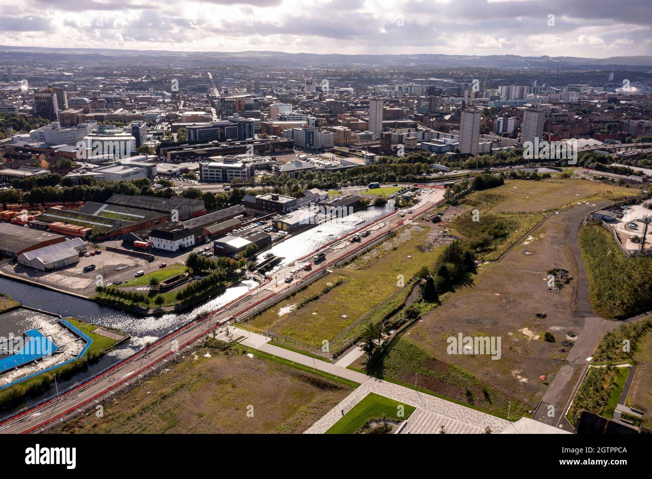 Glasgow, Scotland, UK. 29 September 2021 PICTURED:  Aerial drone view of Glasgow’s Sighthill area showing the new bridge over the M8 Motorway which joins the north of the city centre form the East going through to Charing Cross. The Sighthill area is seeing a capital investment of £250million with new recreational areas and social housing to the north of the city. Also in the area are white water rafting and kayaking training centres along with wakeboarding training facilities. Credit: Colin Fisher Stock Photo