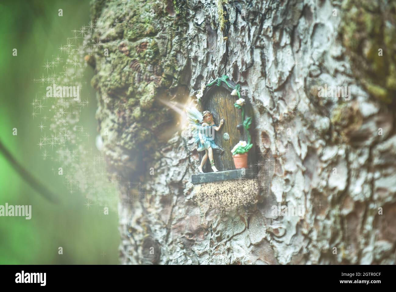Fantasy magical fairy at a door in a tree Stock Photo