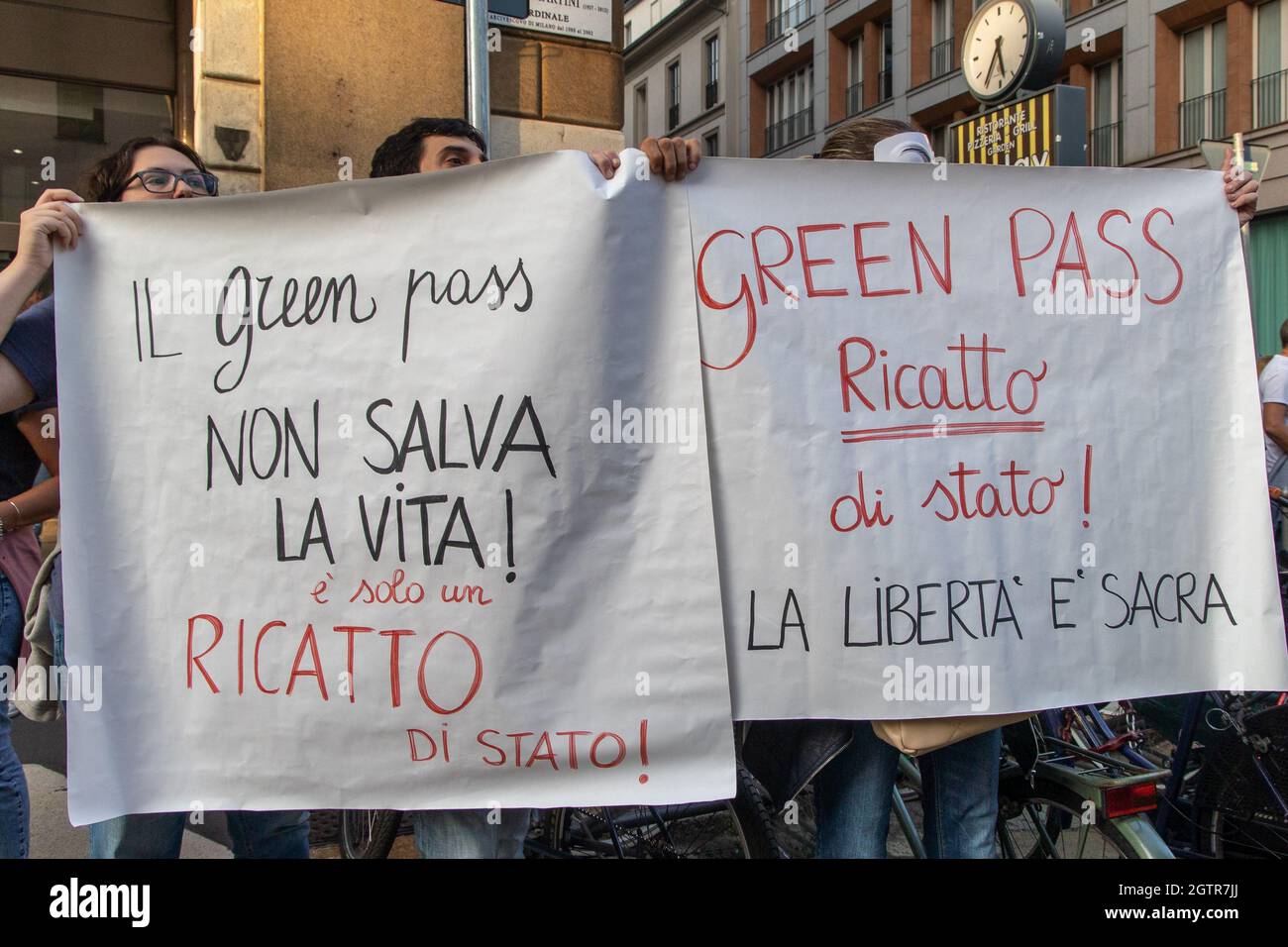 Milan, Italy - october 2 2021 - People holding banners at a rally against green pass and forced vaccination against covid in Italy 19 Credit: Christian Santi/Alamy Live News Stock Photo