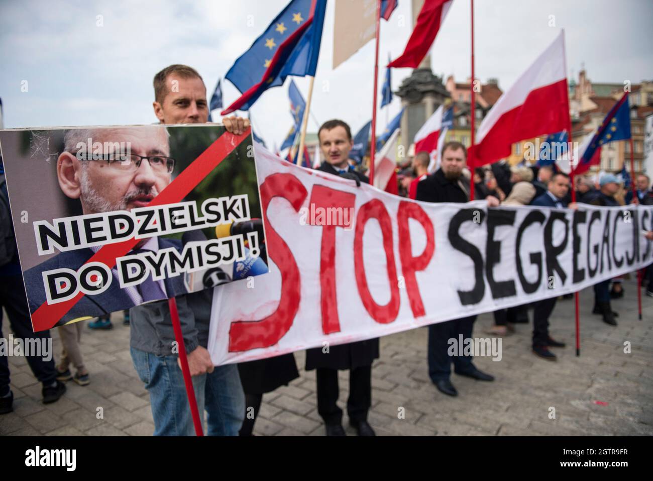 Warsaw, Poland. 02nd Oct, 2021. A protester holds a placard with a crossed out image of the Minister of Health Adam Niedzielski during the demonstration.Hundreds of people took part in the annual March of Freedom and Sovereignty under the slogan 'Stop Sanitary Segregation' organized by the Confederation (Konfederacja) far-right nationalist political party. Participants wanted to oppose sanitary segregation, coercion of COVID-19 vaccinations. Credit: SOPA Images Limited/Alamy Live News Stock Photo