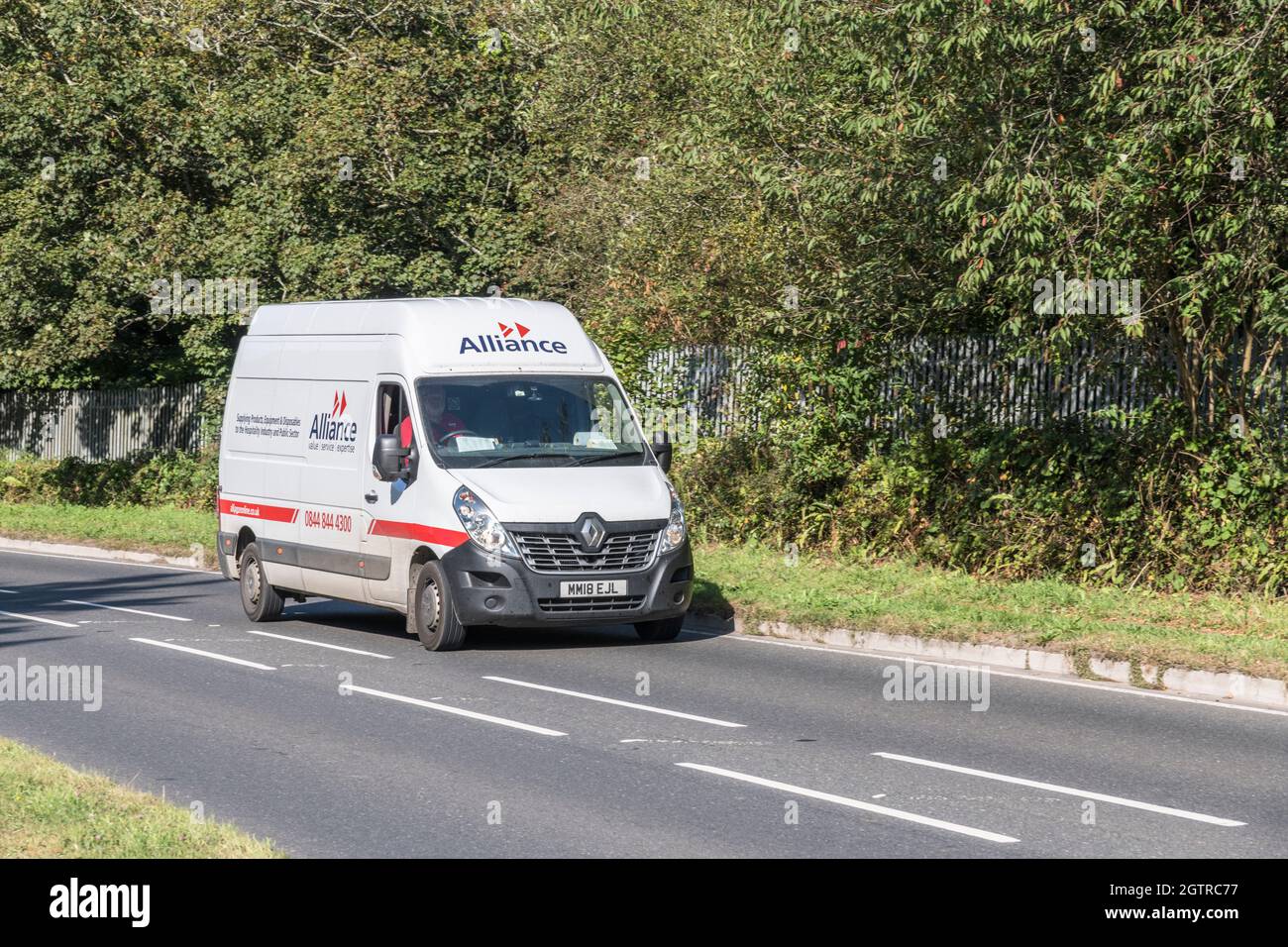 Alliance catering supplies Renault delivery van going uphill on country road. For UK driver shortage, goods delivery during Covid, UK transport Stock Photo