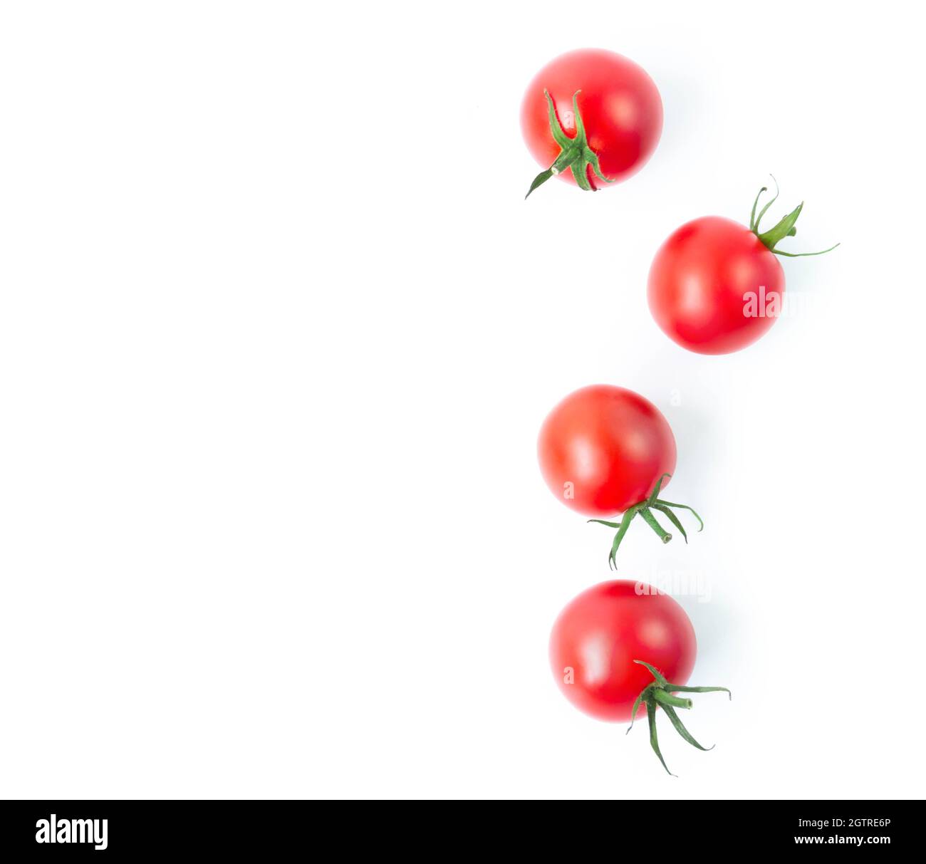 Directly Above Shot Cherry Tomatoes On White Background Stock Photo