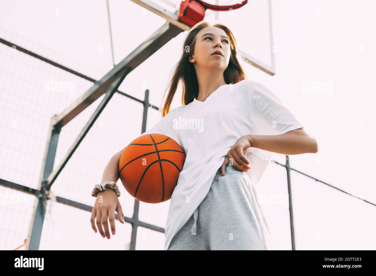Portrait Of Young Female Basketball Player. Beautiful Teen Girl Playing  Basketball Stock Photo - Alamy
