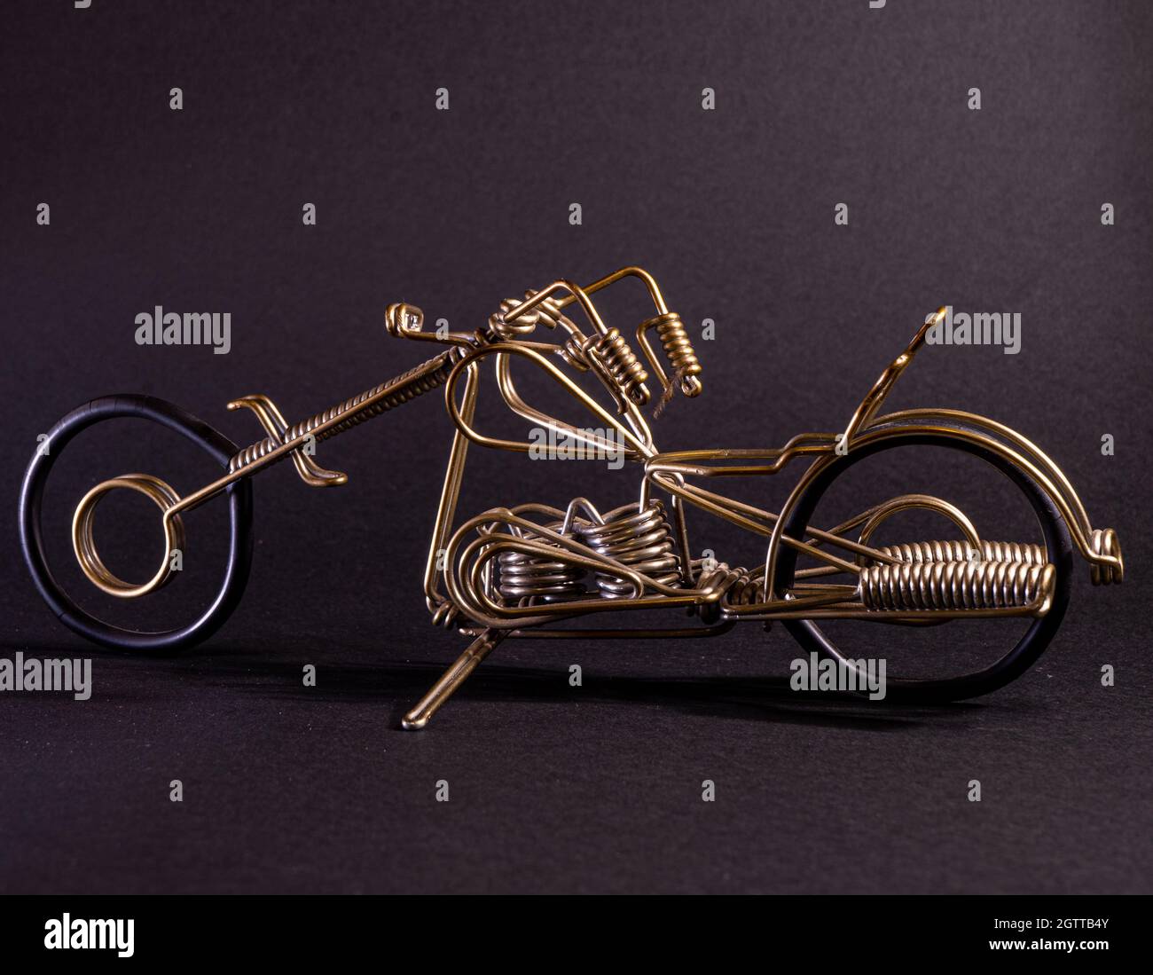 motorcycle made of wire with a dark background Stock Photo Alamy