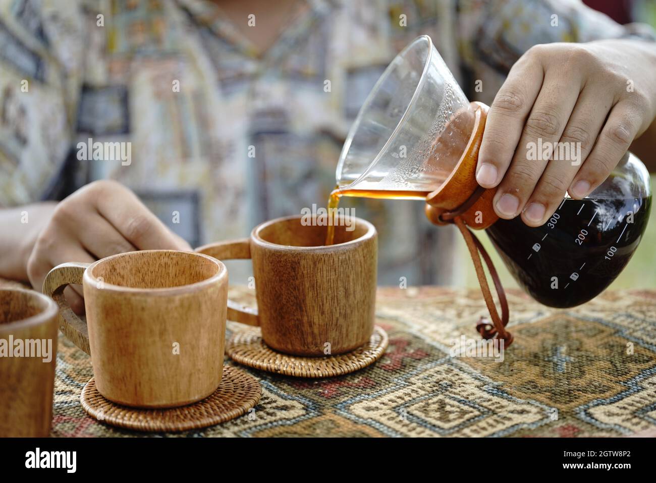 Midsection Of Man Pouring Tea Stock Photo