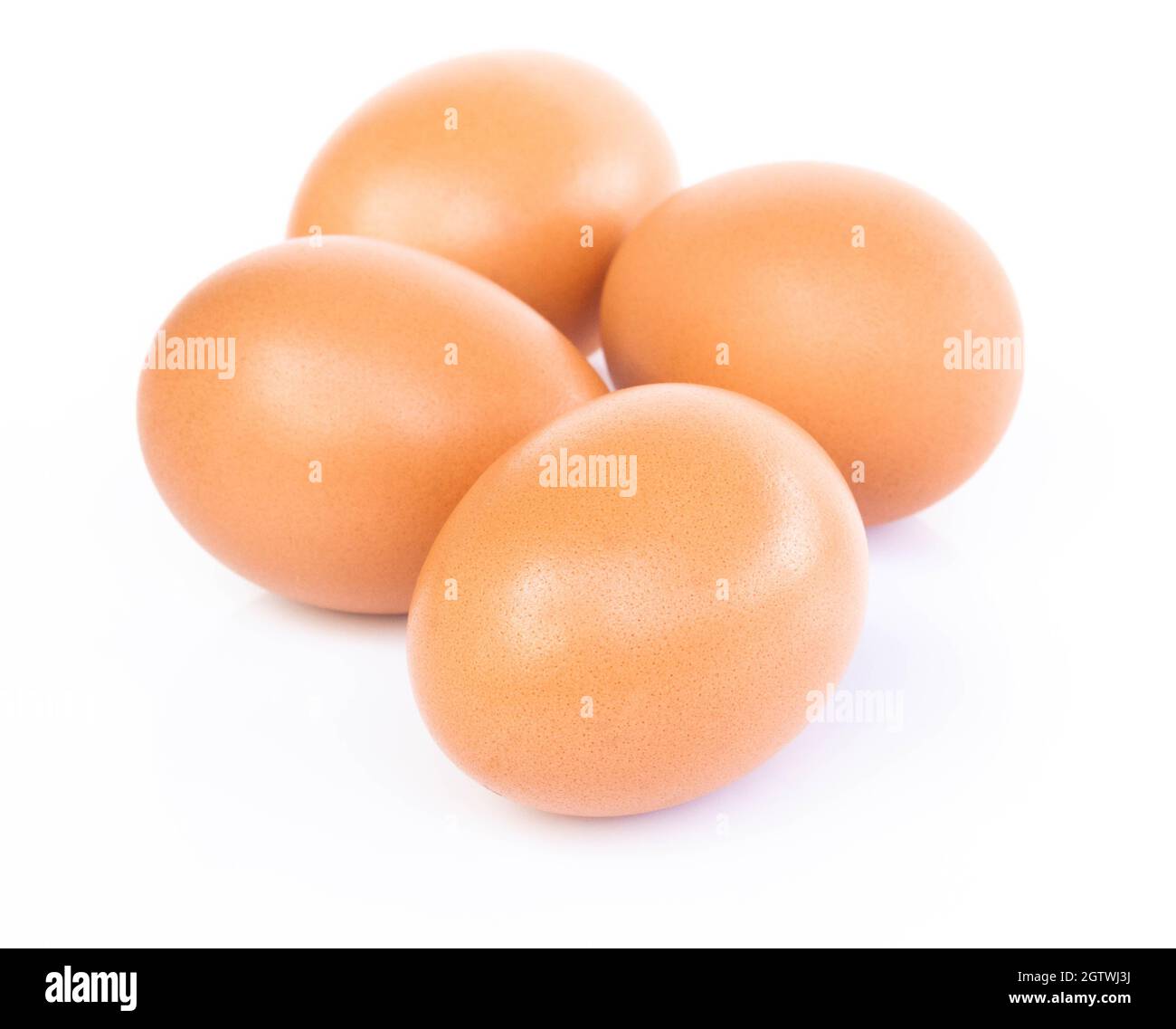 Close-up Of Eggs Against White Background Stock Photo