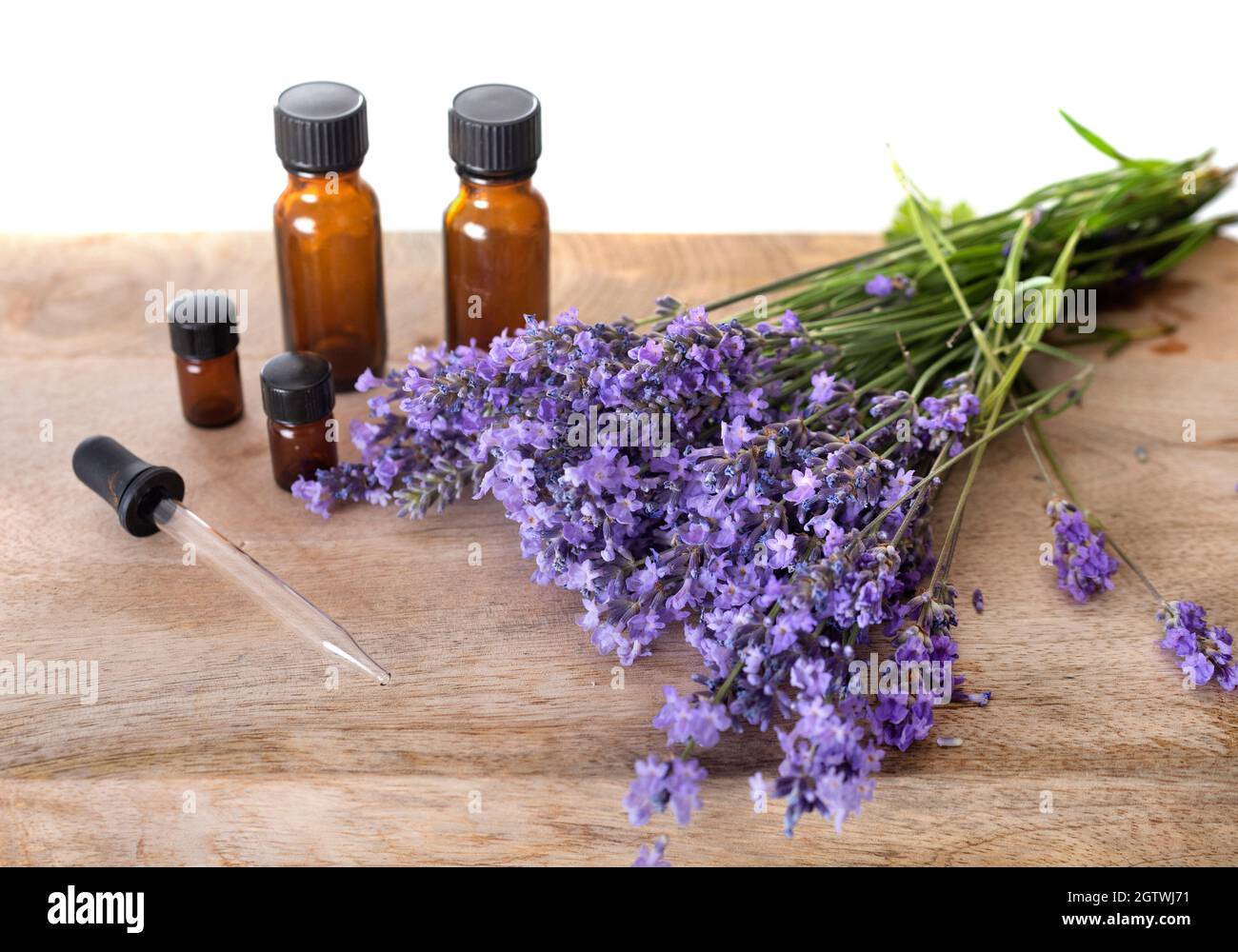 Lavender Flowers With Bottles On Table Stock Photo