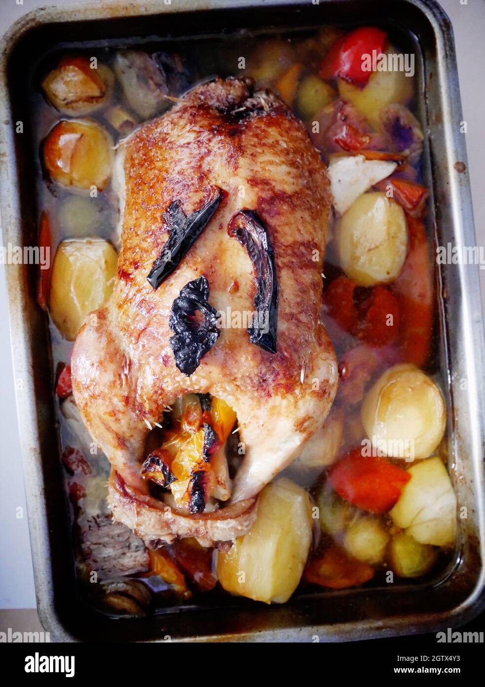 High Angle View Of Roasted Meat And Vegetables Served In Tray Stock Photo