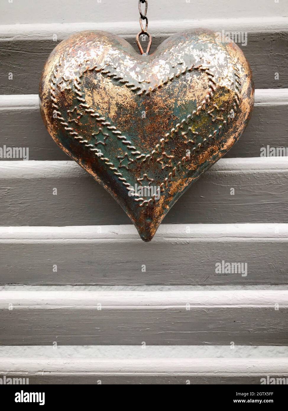 Close-up Of Heart Shape Against Wall Stock Photo
