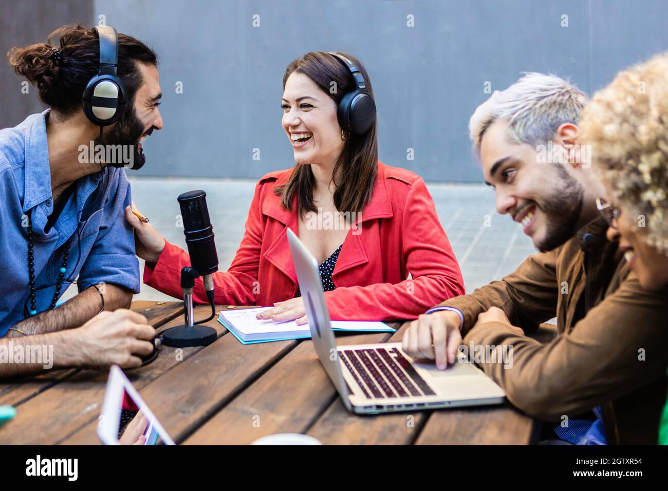 Happy friends creating content on streaming network platform Stock Photo