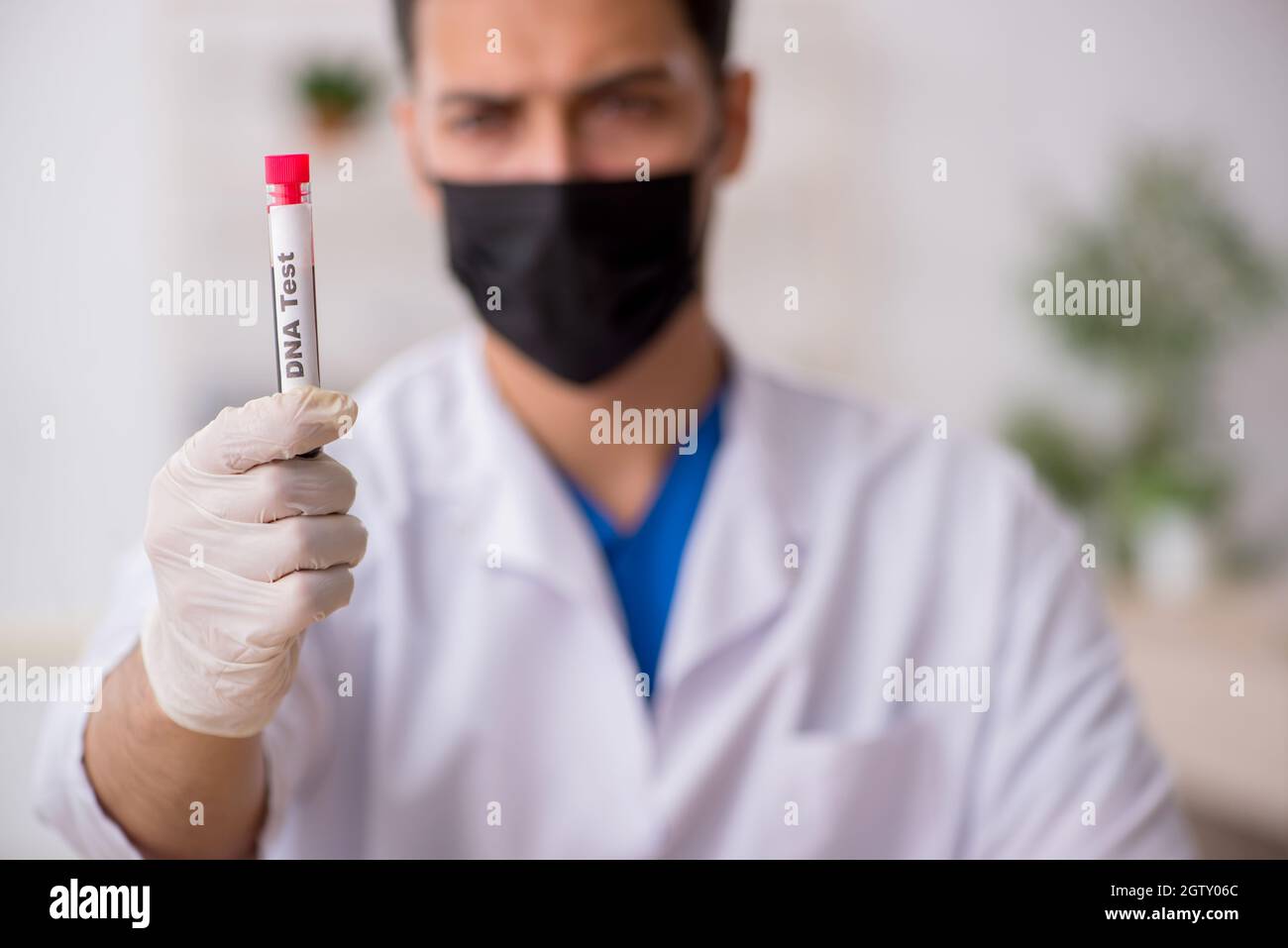 Young biochemist testing blood samples Stock Photo
