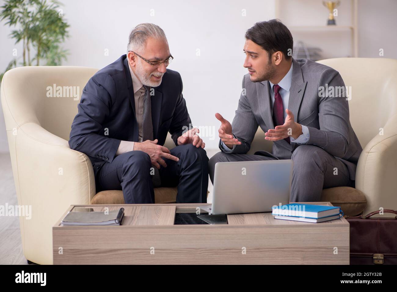 Two businessmen discussing project in the office Stock Photo