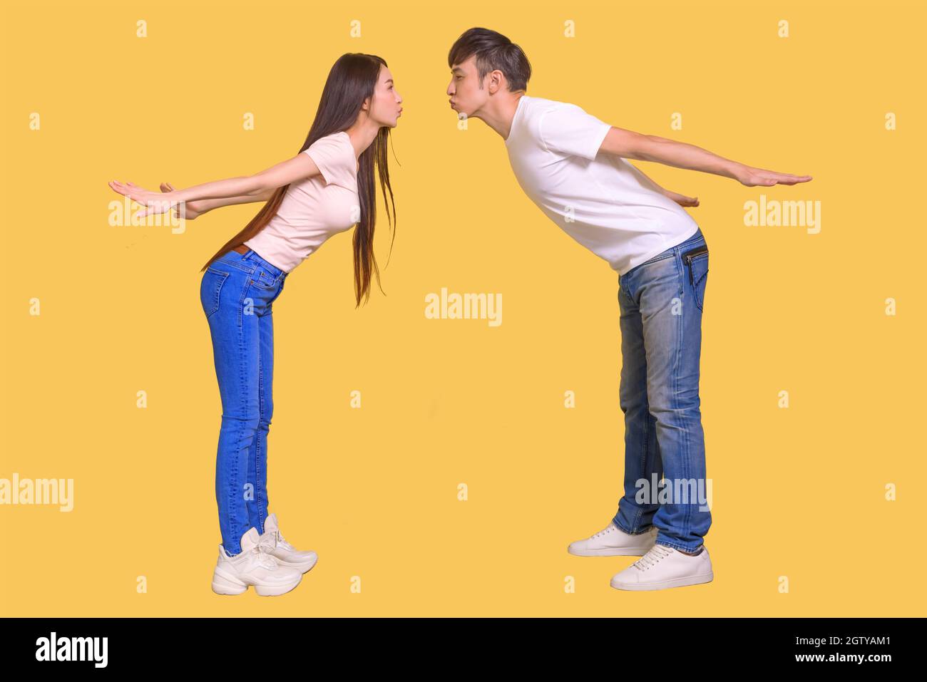 young Asian couple being happy and kissing Stock Photo
