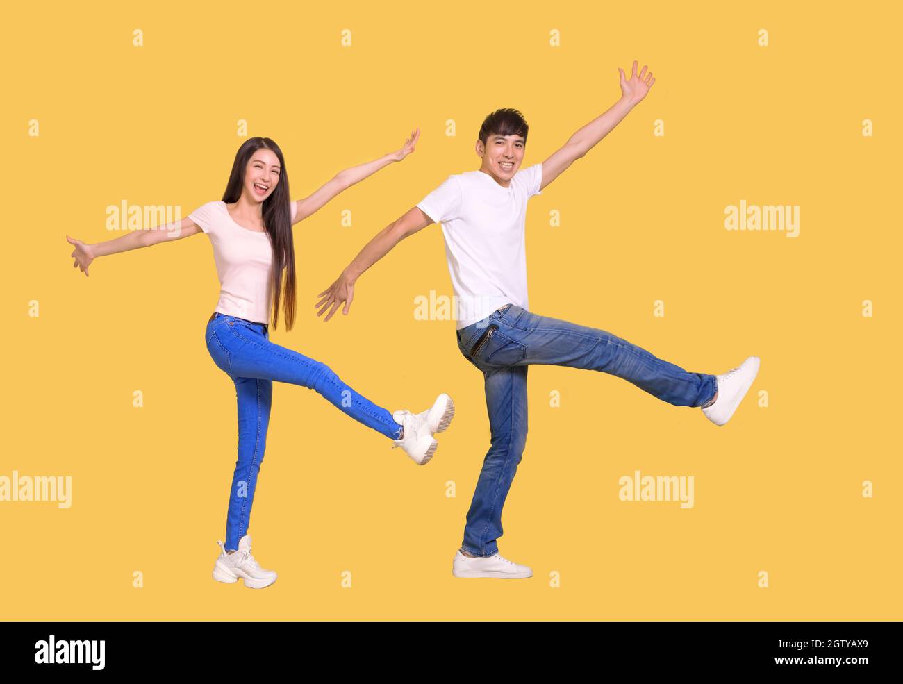 young Asian couple being happy and dancing Stock Photo