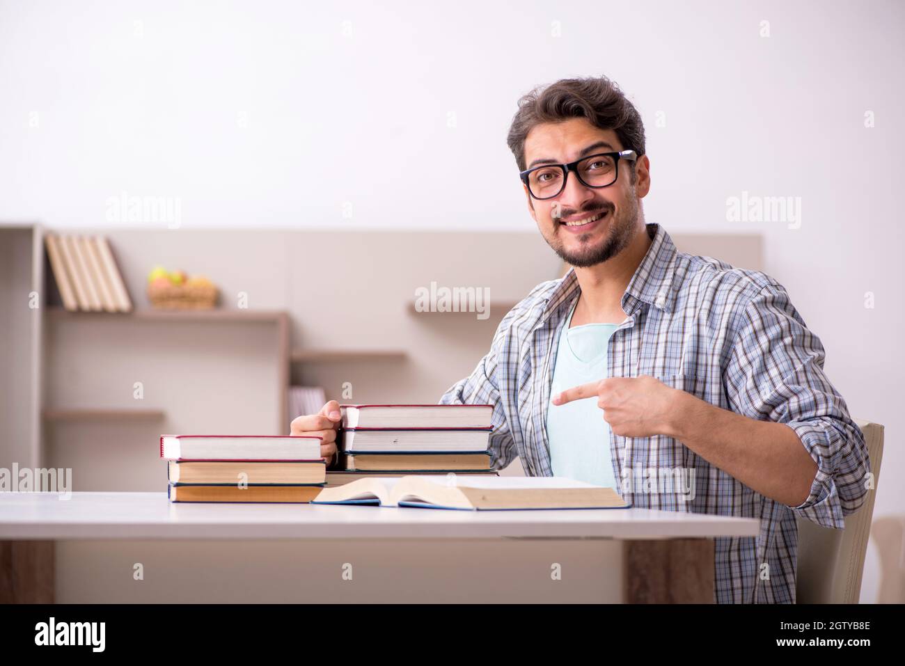 Young student preparing for exams at home Stock Photo - Alamy