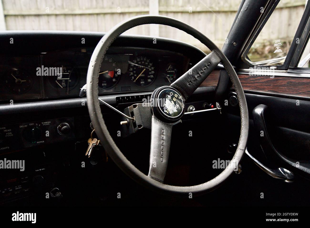 P6 Rover 3500s V8 steering wheel interior, close up of the logo on the steering wheel of a Rover P6. Stock Photo