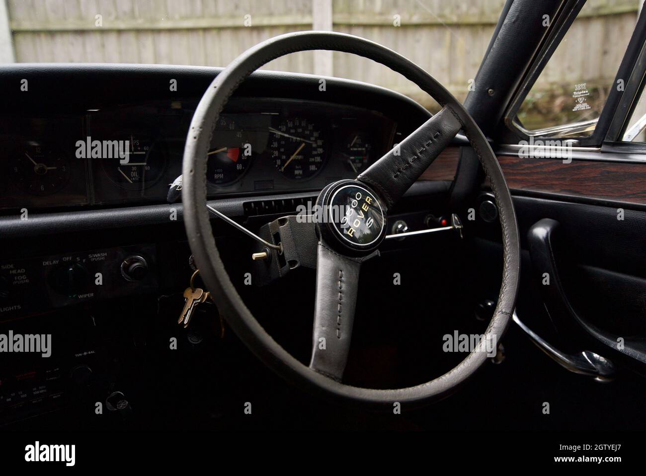 P6 Rover 3500s V8 steering wheel interior, close up of the logo on the steering wheel of a Rover P6. Stock Photo