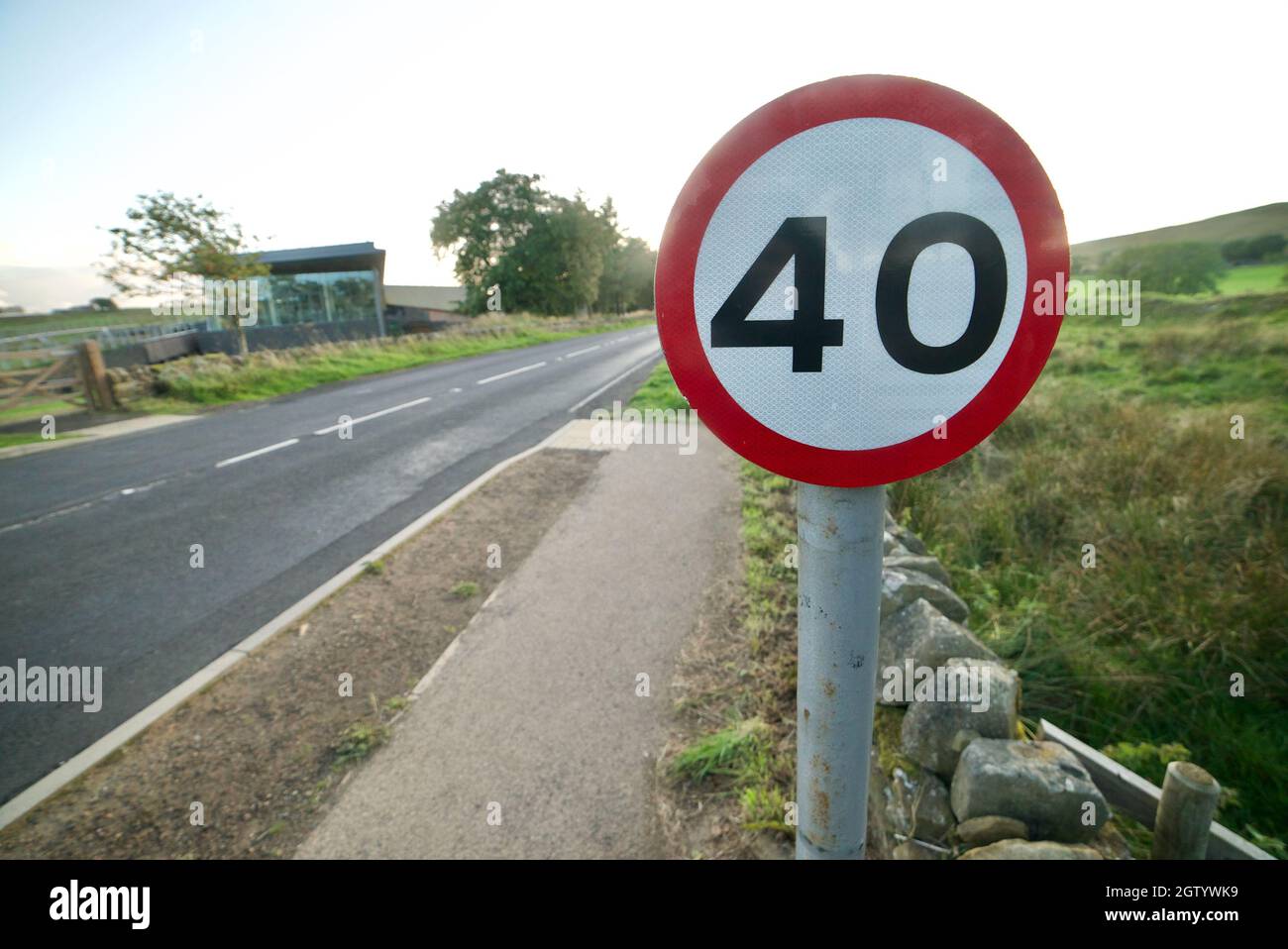 40MPH road sign along a country road in England. 40 MPH British sign post next to a road. Stock Photo
