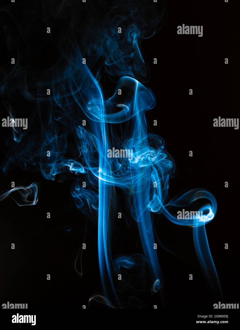 Close-up Of Incense Smoke Against Black Background Stock Photo