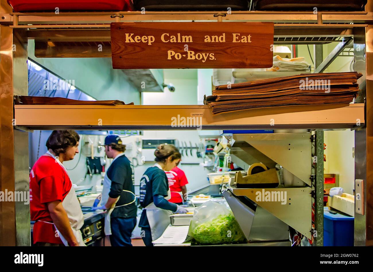 The pick-up window at Parkway Tavern & Bakery features a sign encouraging customers to “Keep calm and eat po-boys,” Nov. 12, 2015, in New Orleans, La. Stock Photo