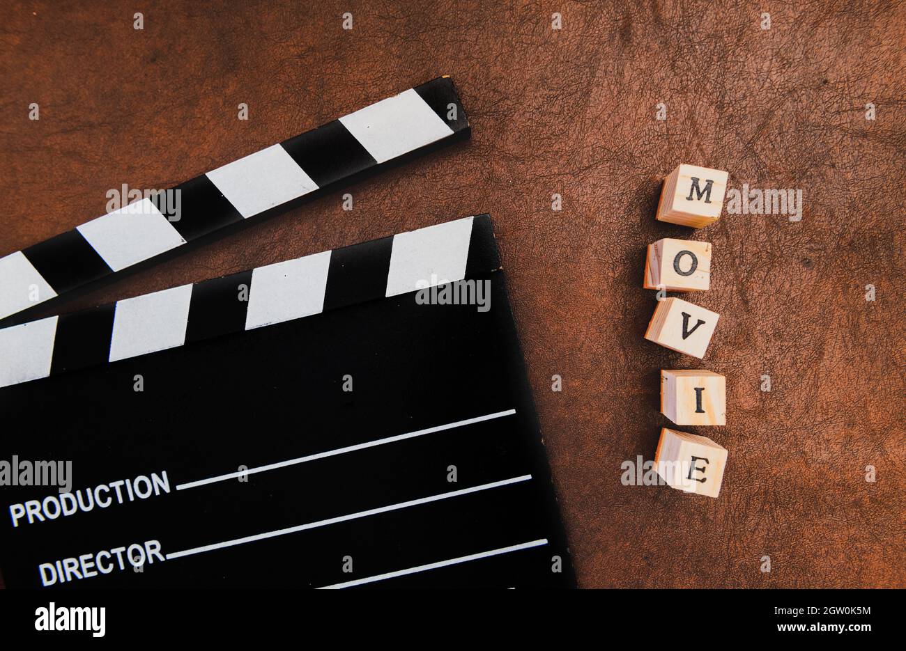 Directly Above Shot Of Film Slate And Text On Rusty Table Stock Photo
