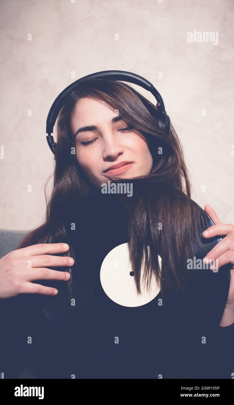 Smiling Young Woman Holding Record Stock Photo