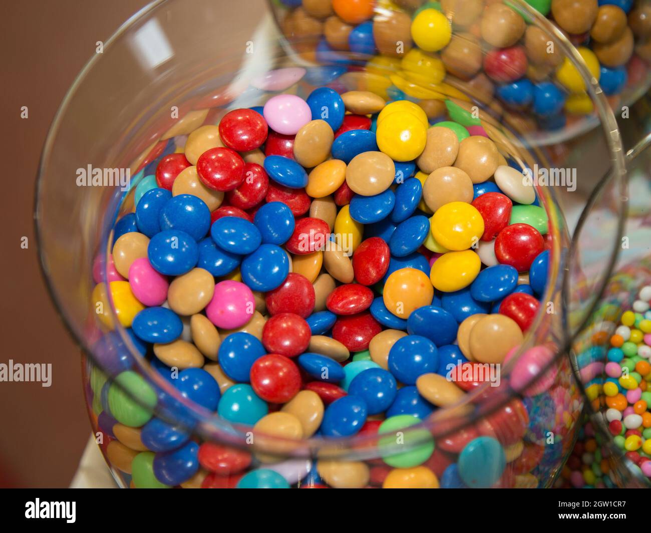 Colorful Confetti Candy Inside Transparent Glass Container Stock Photo