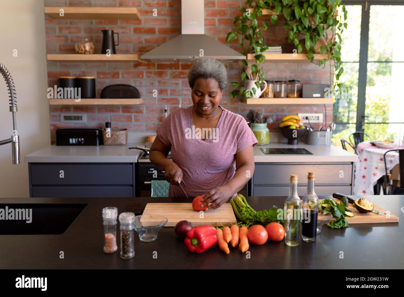 African american woman cooking dinner hi-res stock photography and ...