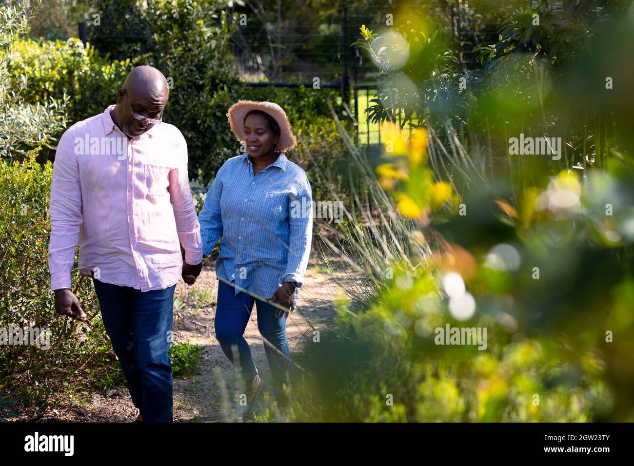 Happy african american senior couple holding hands outdoors Stock Photo ...