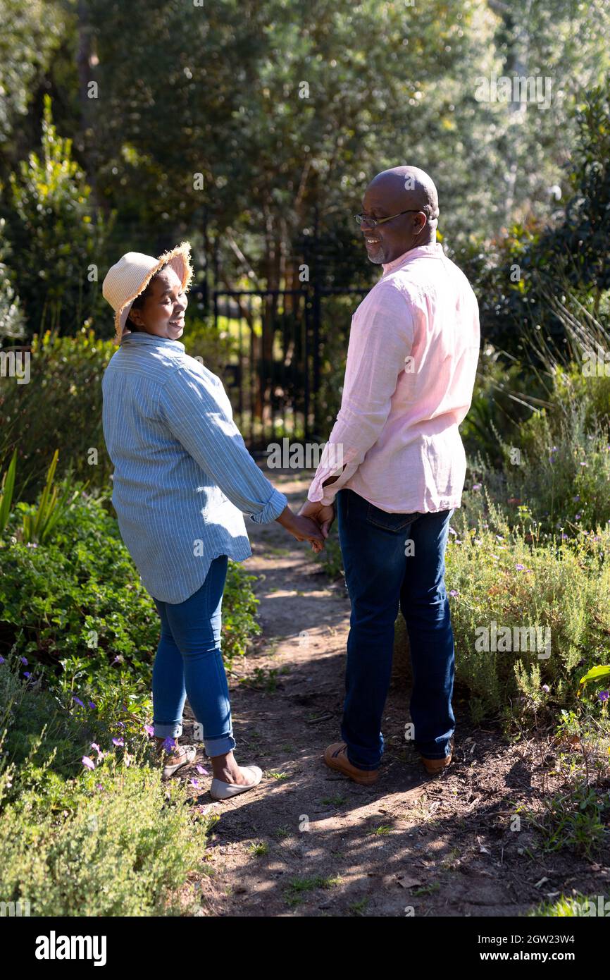 Happy african american senior couple holding hands outdoors Stock Photo ...