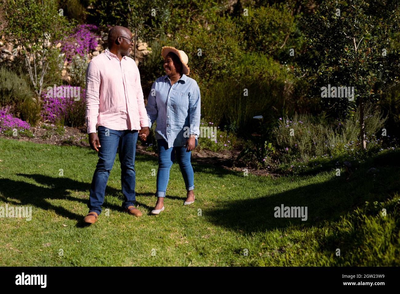 Happy african american senior couple holding hands outdoors Stock Photo ...