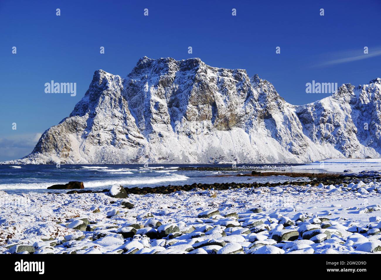 Scenic View Of Snowcapped Mountains Against Blue Sky Stock Photo