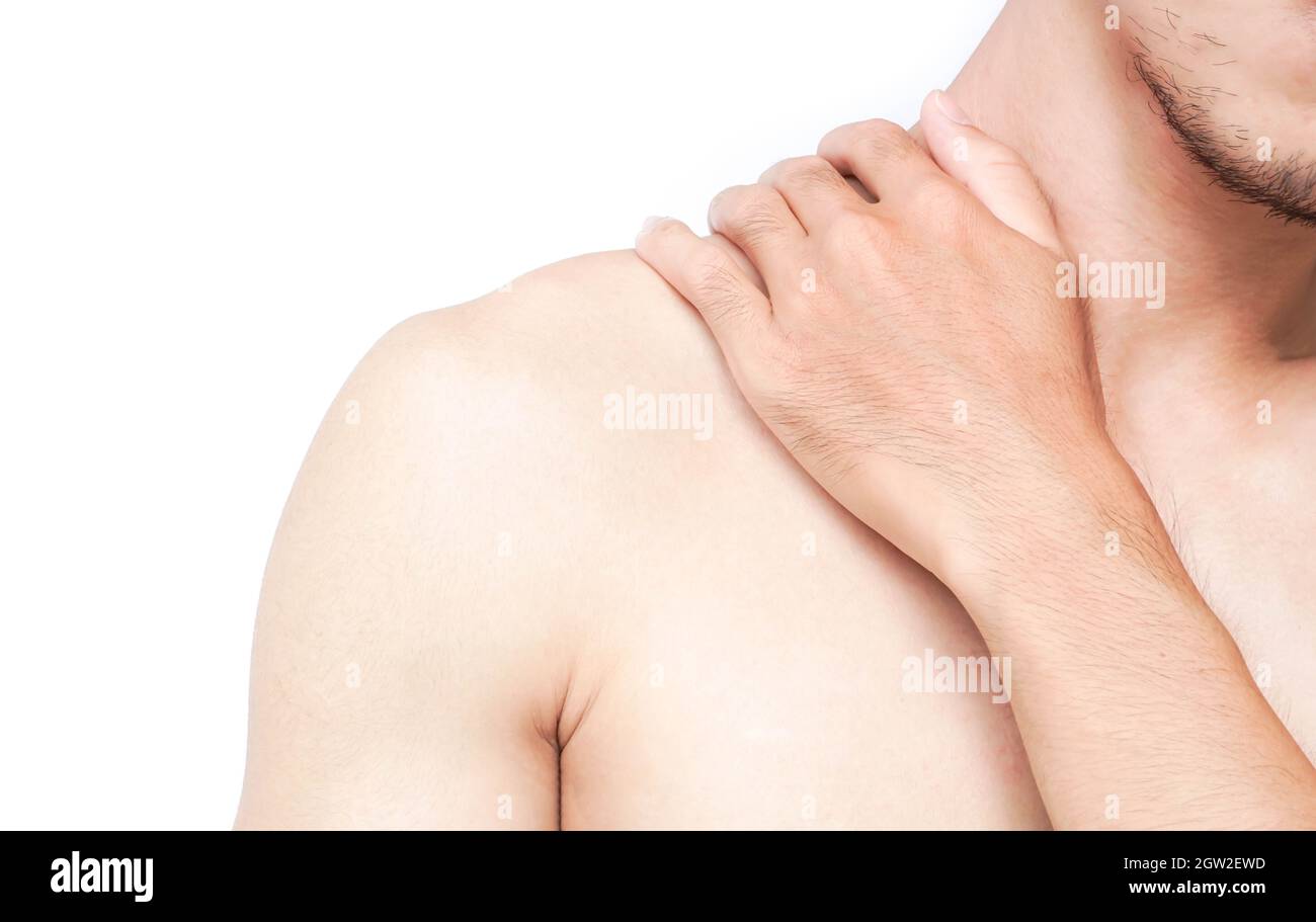 Midsection Of Shirtless Man With Shoulder Pain Against White Background Stock Photo