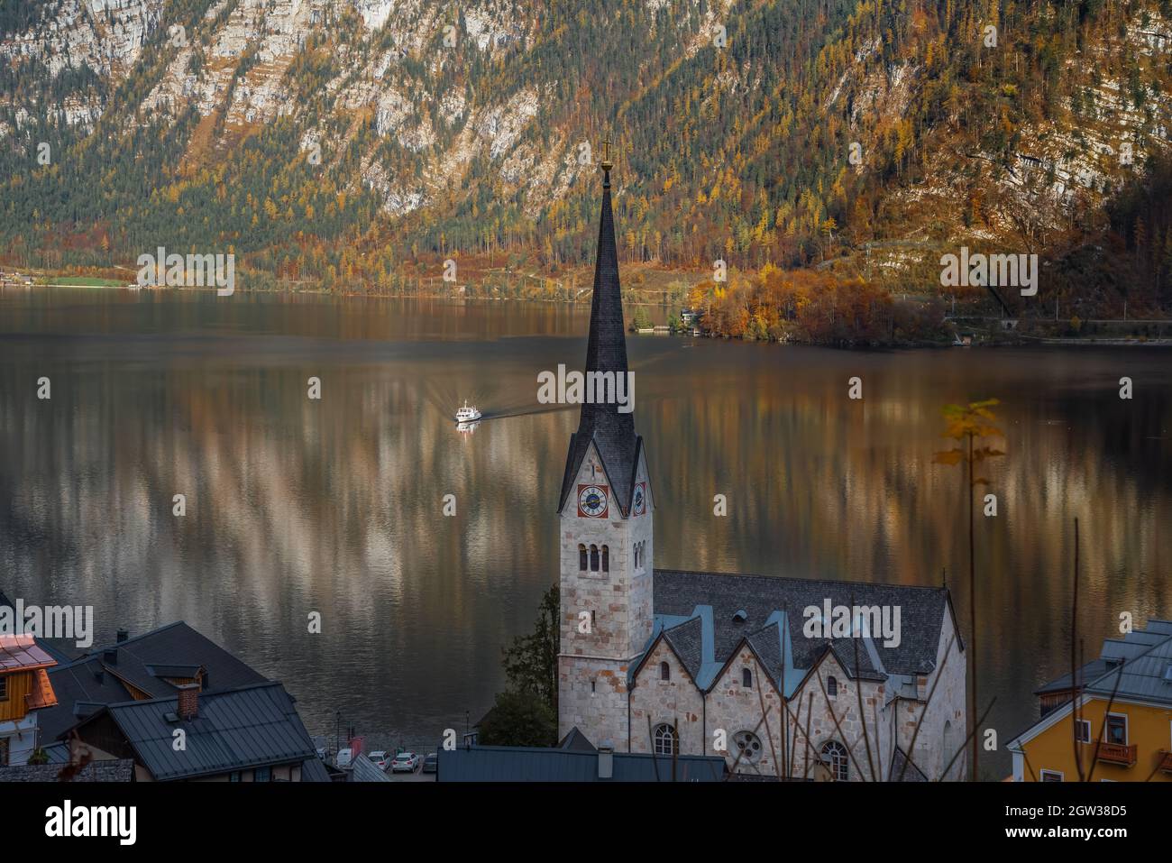 Ferry Boat on Lake Hallstatt and Hallstatt Evangelical Church ...